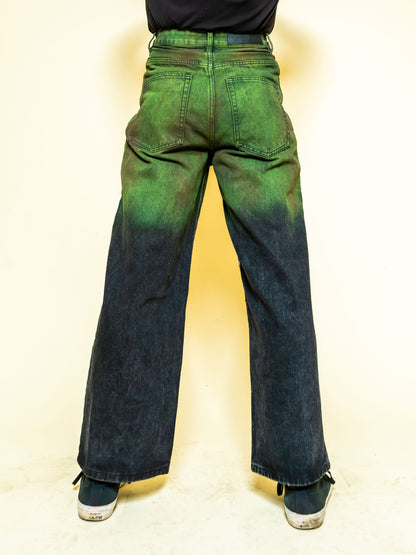 The PAiNtR paint splatter wide leg denim jeans on model | F.A.M.E. X streetwear