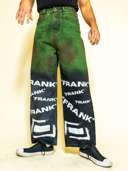 The PAiNtR paint splatter wide leg denim jeans on model | F.A.M.E. X streetwear