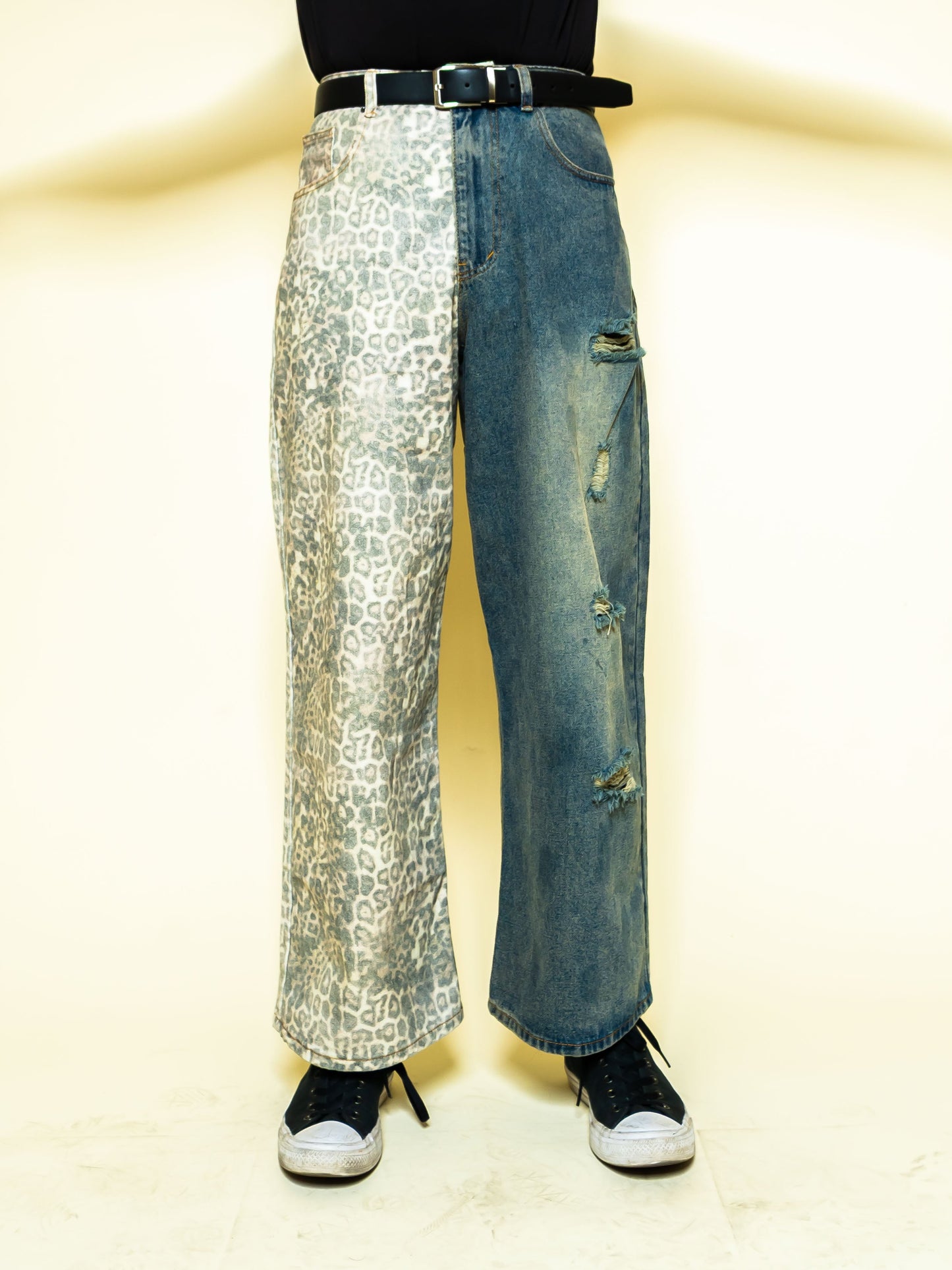 The PAiNtR paint splatter wide leg denim jeans on model | F.A.M.E. X streetwear