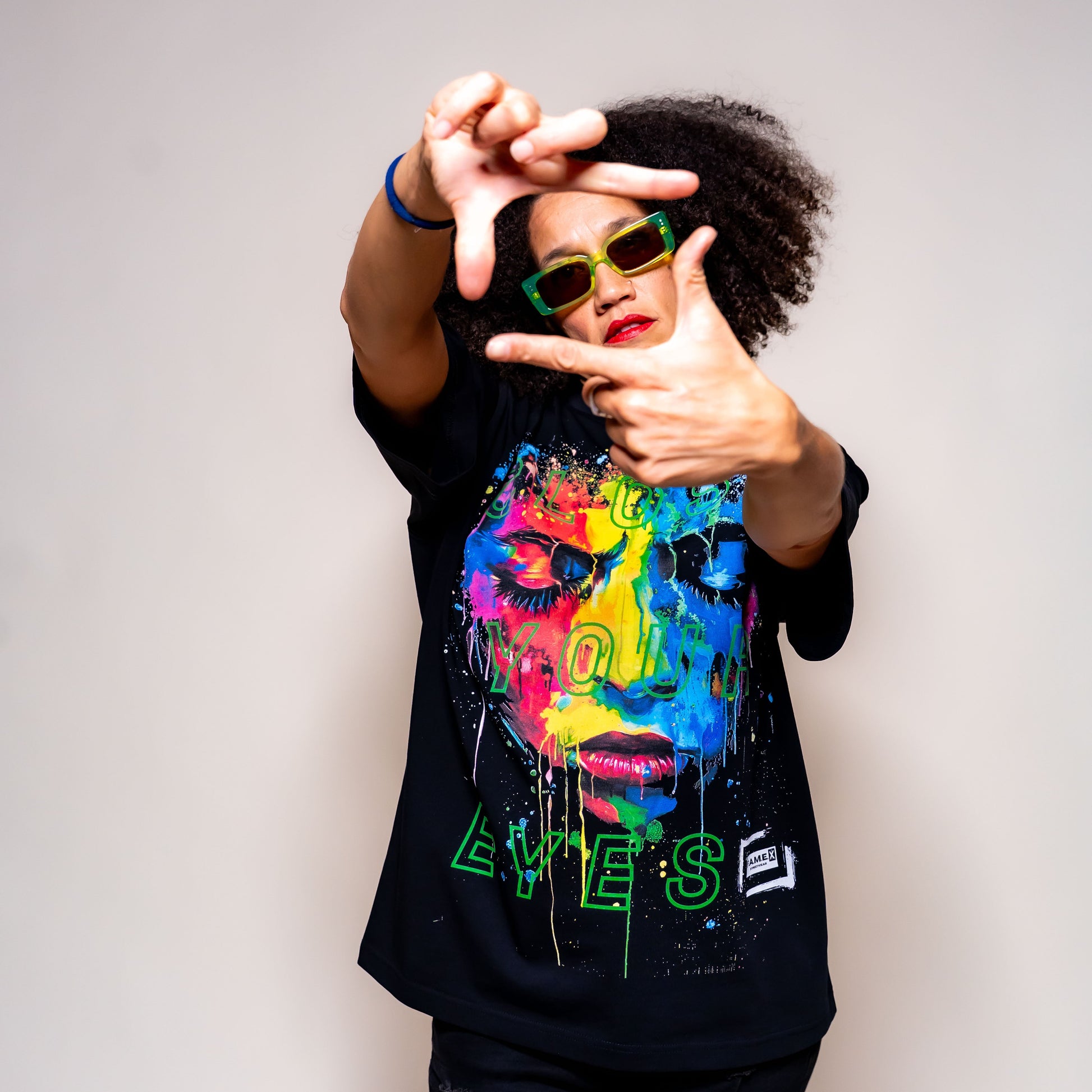 Close Your Eyes surreal pop art portrait graphic tee shirt on model | F.A.M.E. X streetwear
