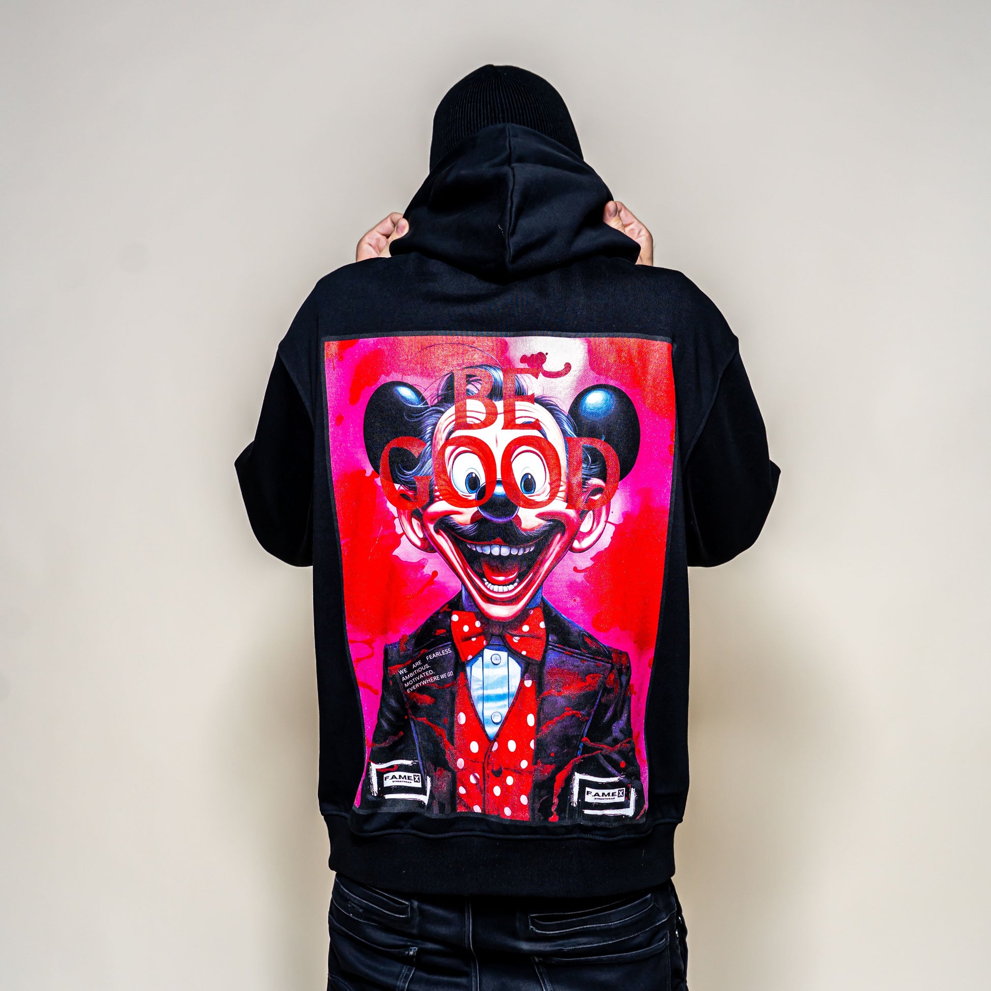BE GOOD horror pop cartoon mascot parody art hoodie on model | F.A.M.E. X streetwear