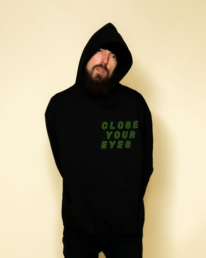 Close Your Eyes surreal pop art portrait hoodie on model | F.A.M.E. X streetwear
