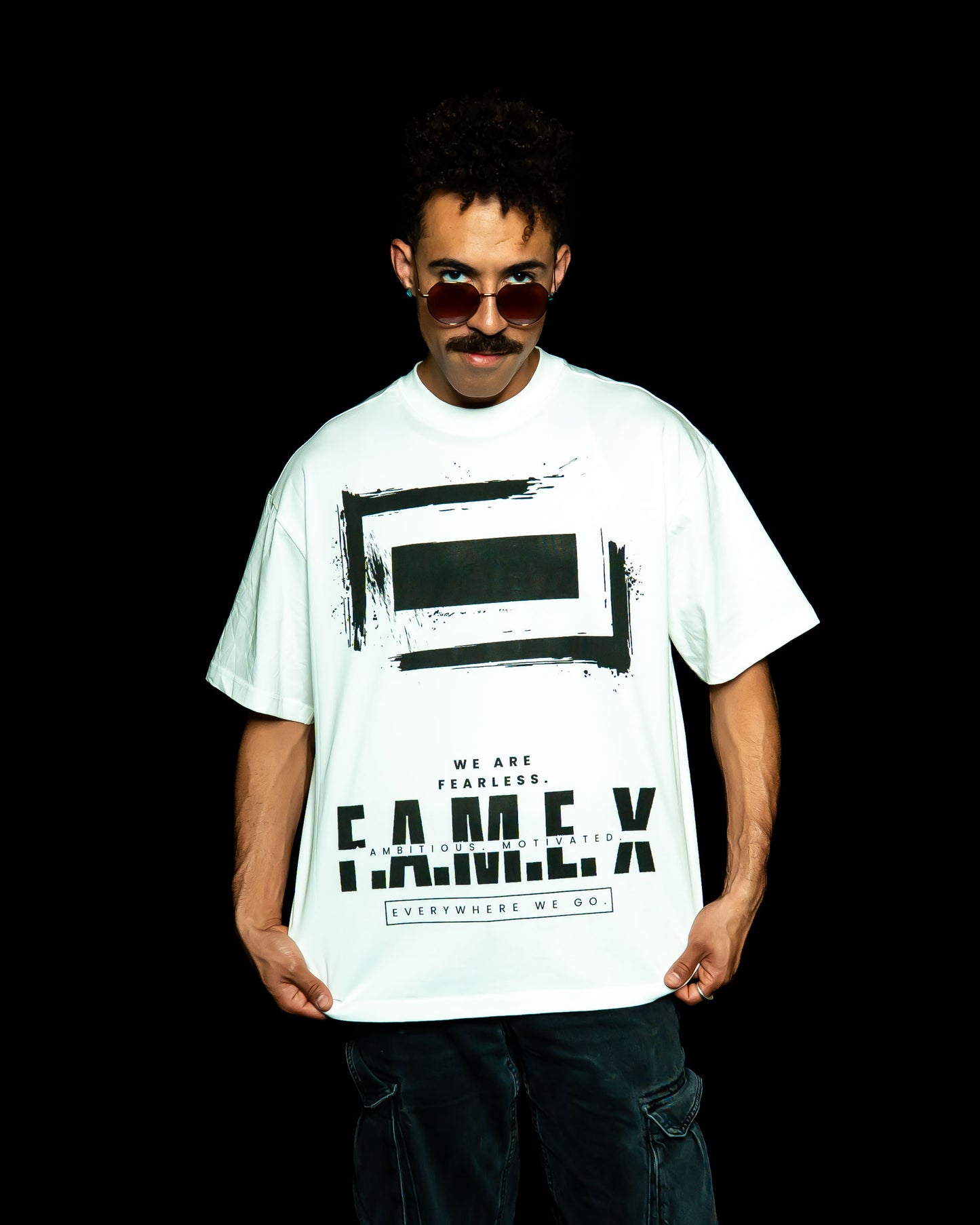 F.A.M.E. X broken frame logo graphic tee shirt on model | F.A.M.E. X streetwear