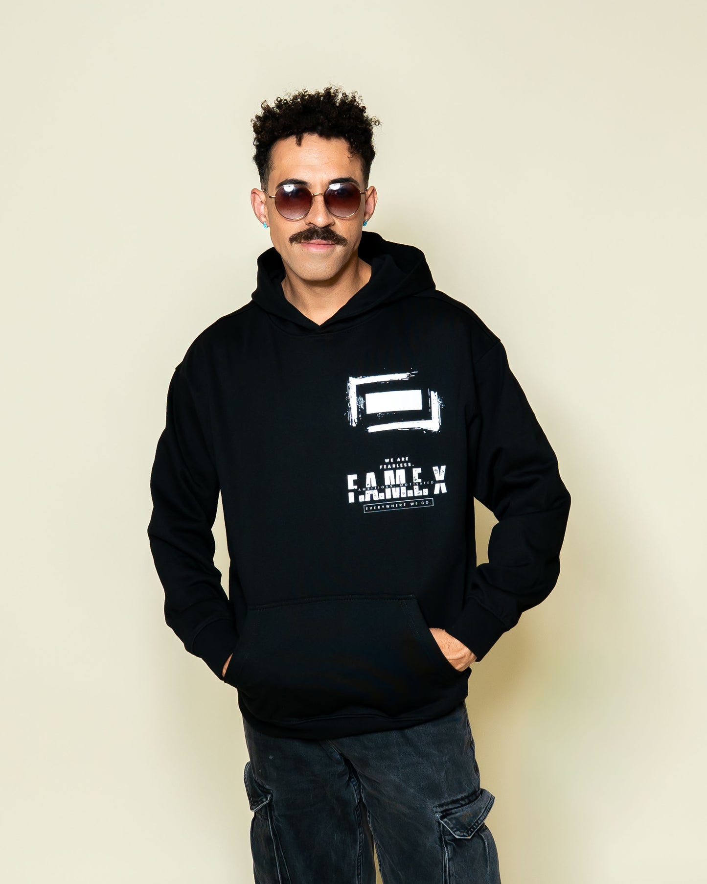 F.A.M.E. X broken frame logo hoodie on model | F.A.M.E. X streetwear